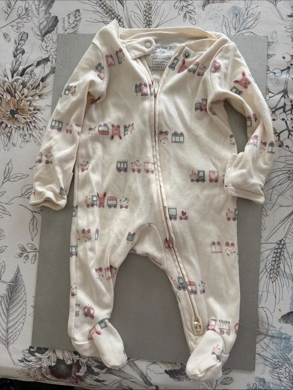 Carter's Cream Footed One-Piece Sleeper with Pastel Train Print